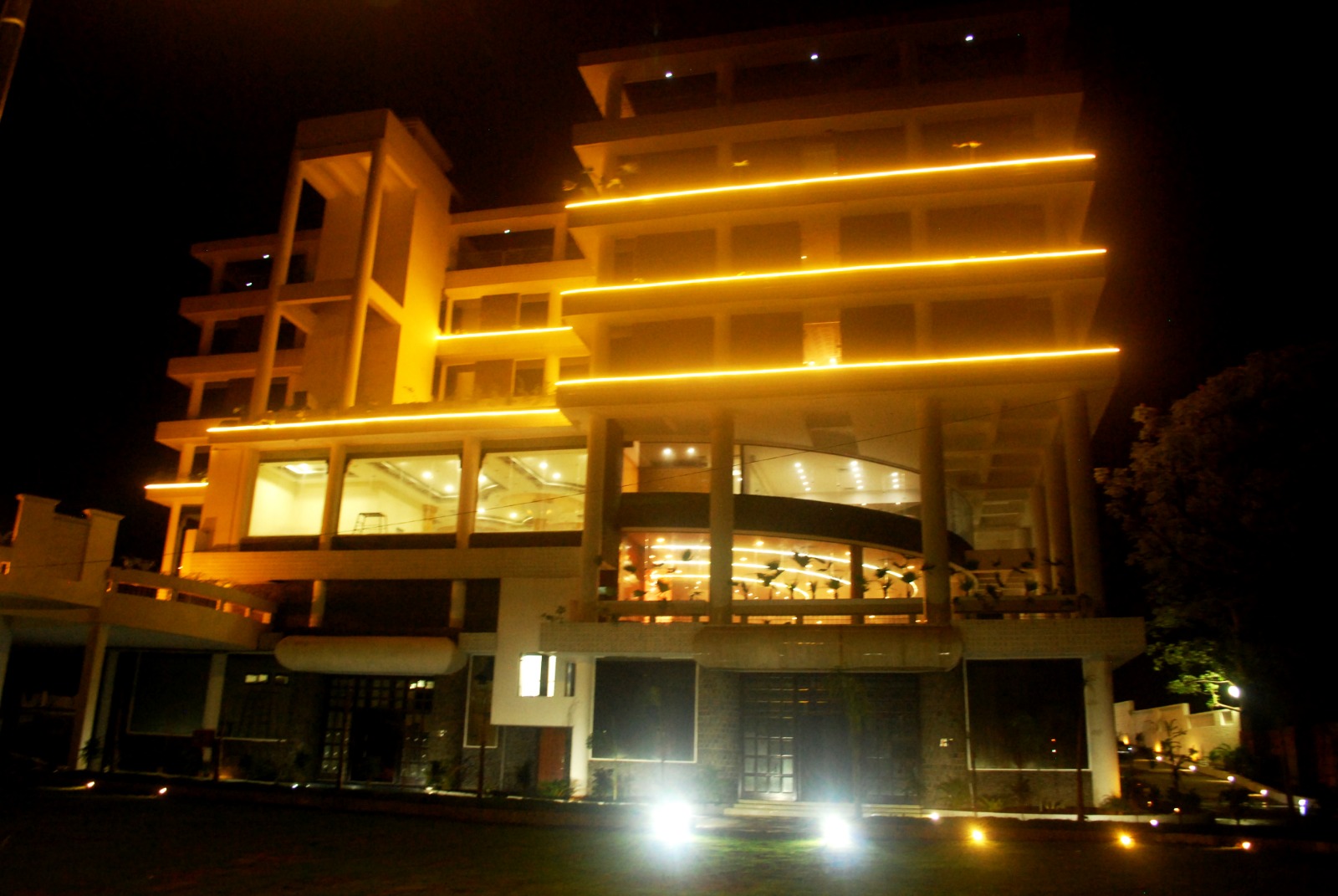Hotel Solitaire — illuminated night facade